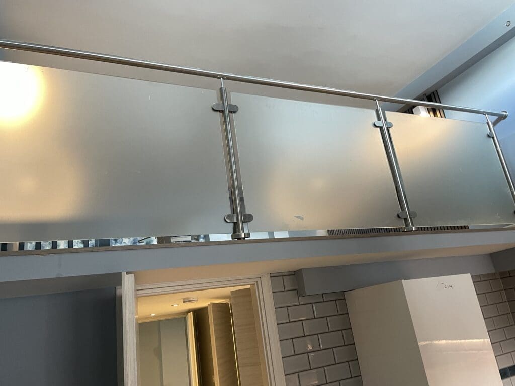 Internal glass balustrade with obscure glass panels