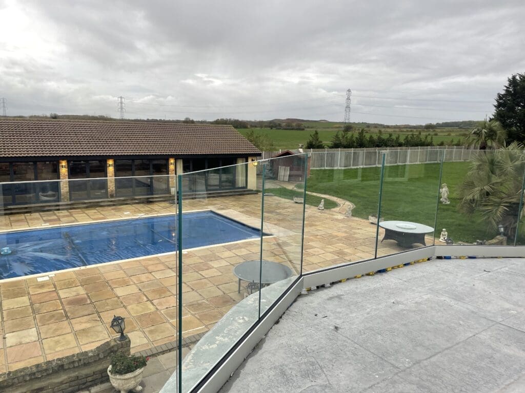 Frameless glass balustrade installed for a customer in Essex. Using 17.5mm toughened laminated glass panels