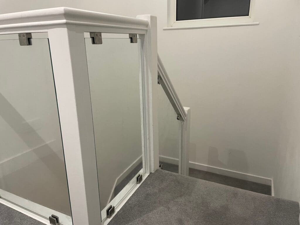 Stylish glass infill panels with stainless steel glass clamps