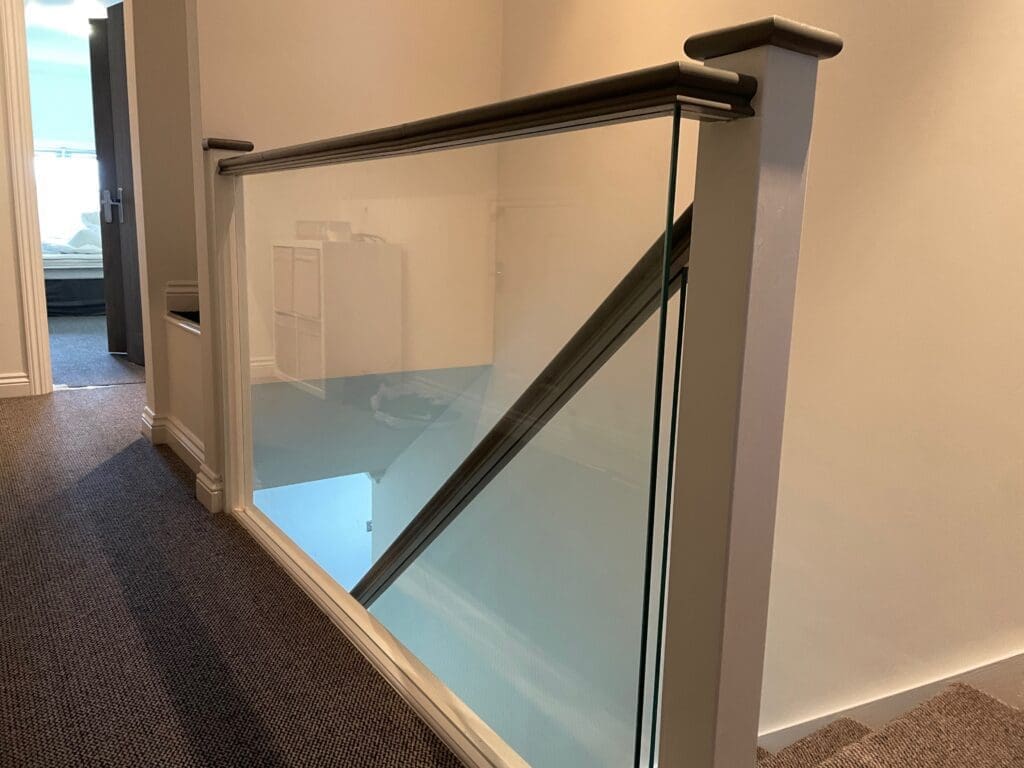 Staircase renovation in Chelmsford, Essex. Stripped out all the old timber and replaces with brand new slotted timber handrails and 10mm clear glass