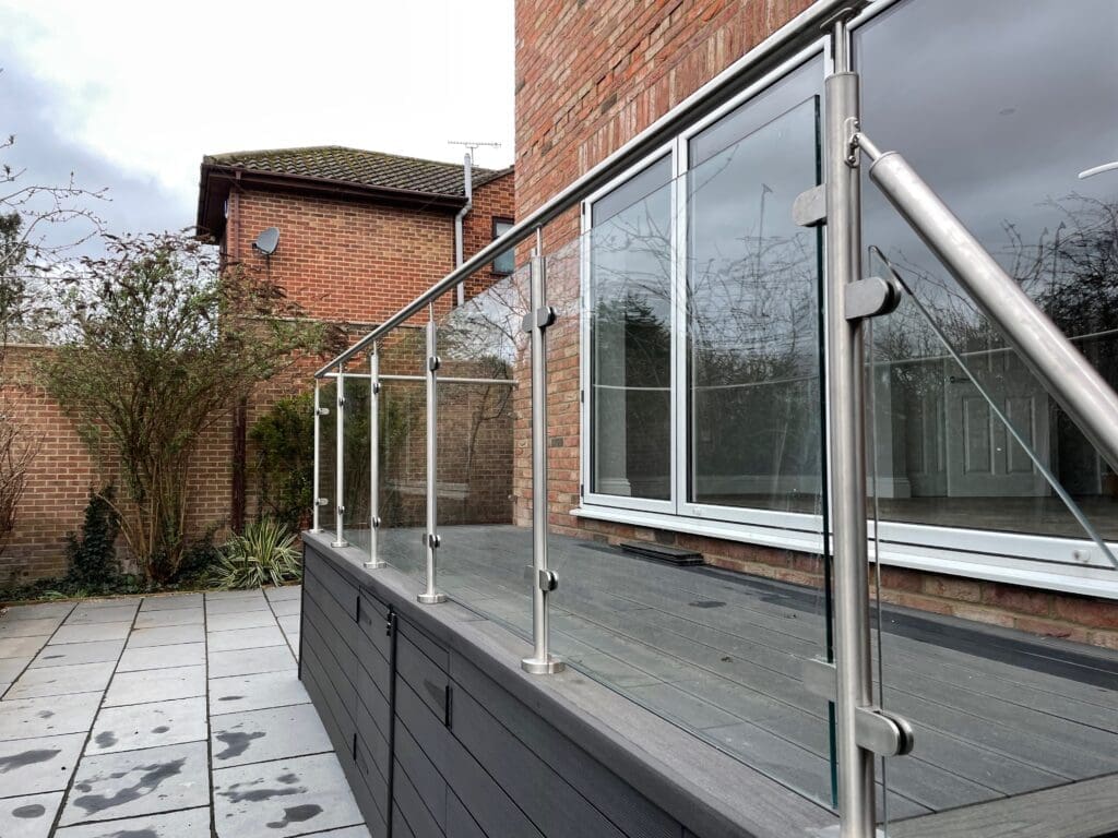 Decking area glass balustrade using stainless steel post and handrail with 10mm toughened glass