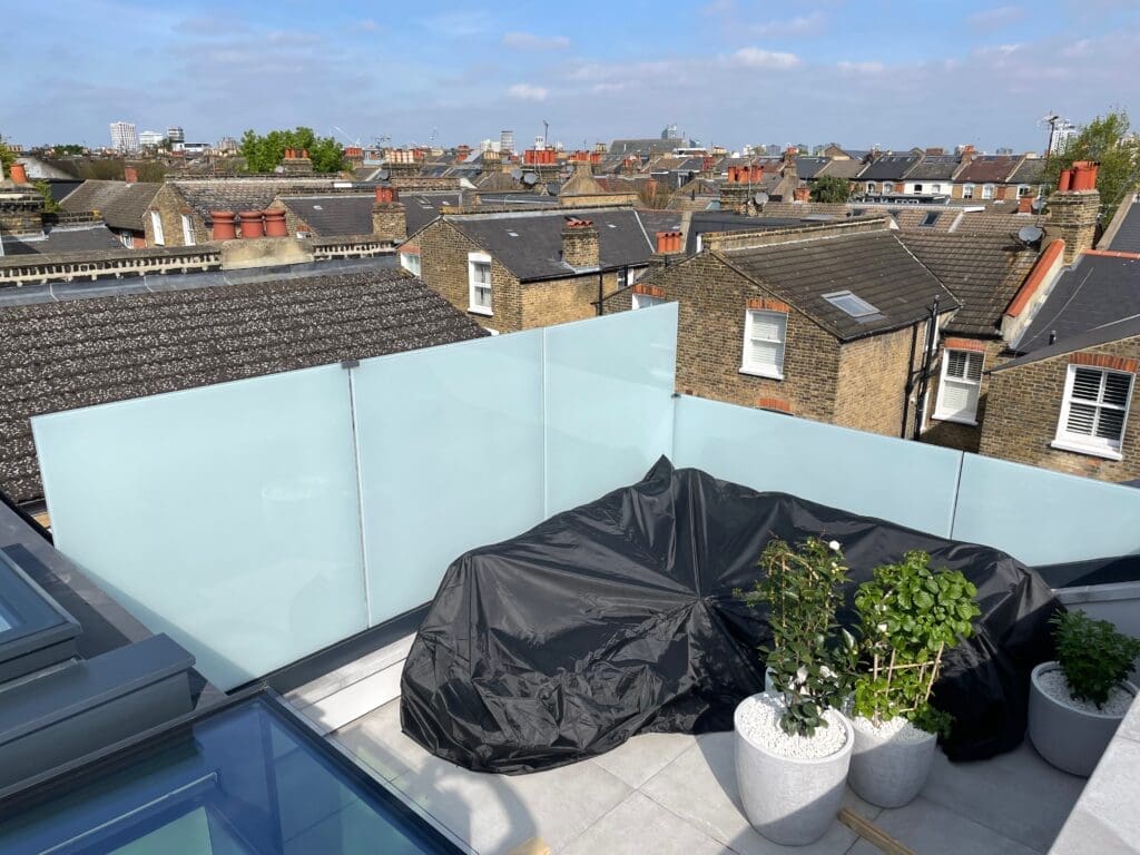 Rooftop opaque glass balustrade supplied and installed for a customer In Clapham, South London