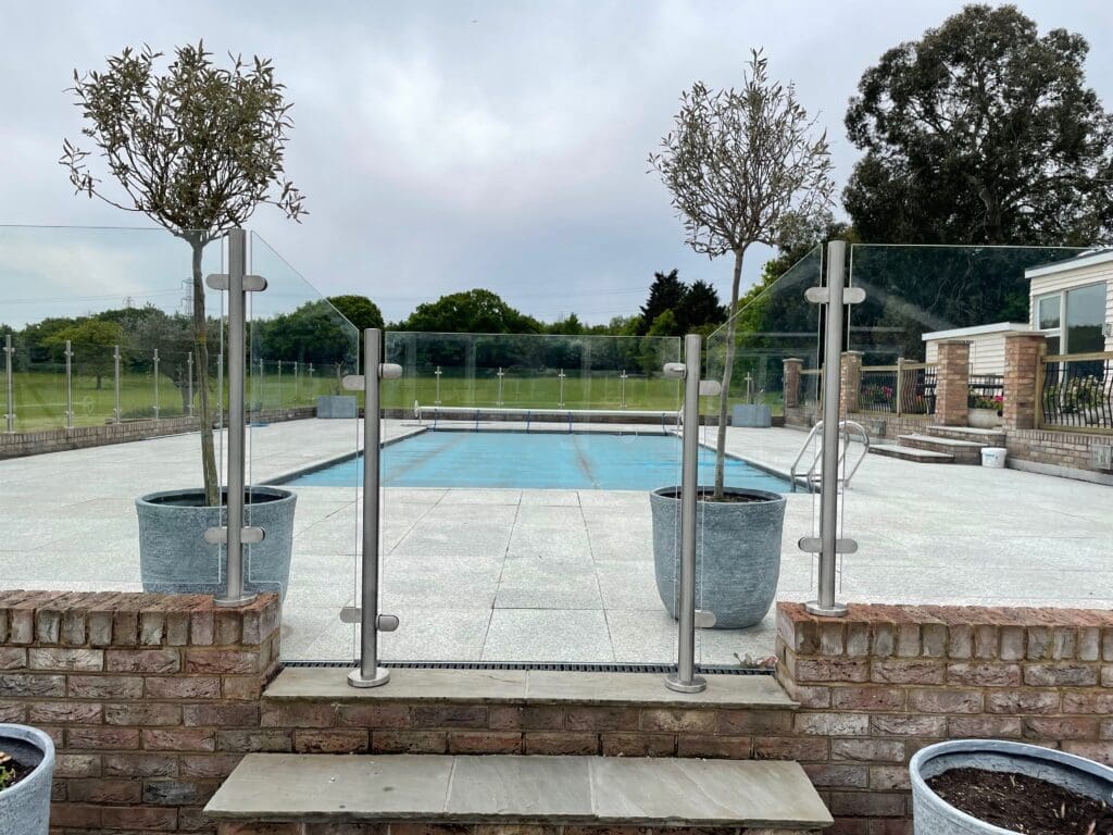 Stylish free floating glass balustrade, with a glass gate which not only looks great. It also gives you complete safety around your swimming pool