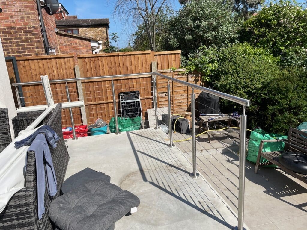 Back garden patio wire balustrade supplied and installed for a customer in South Woodford, London. Using stainless steel post and handrail system