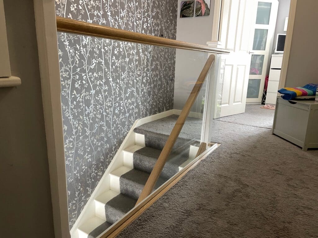 10mm clear toughened glass panel staircase with oak slotted handrail and base rail