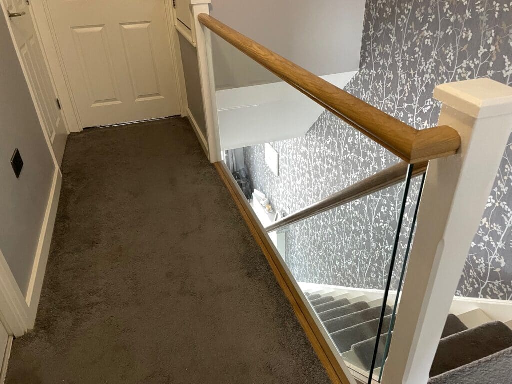 10mm clear toughened glass panel staircase with oak slotted handrail and base rail