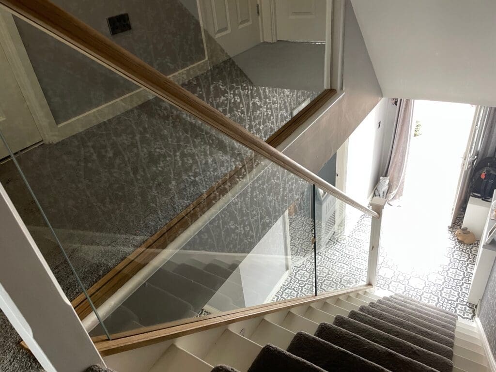 10mm clear toughened glass panel staircase with oak slotted handrail and base rail